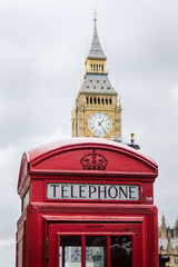 Fototapeta na wymiar Traditional London phone box with big ben in the background