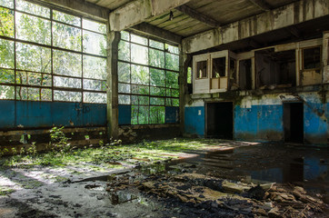 Abandoned industrial hall in the morning sunshine