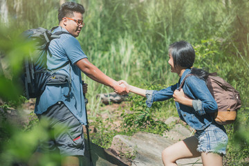 adventure, travel, tourism, hike concept , Smiling couple walking with backpacks outdoors.
