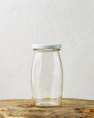 Empty glass jar on rustic wooden table
