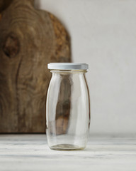 Empty glass jar on rustic wooden table
