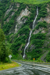 Road by Horse Tail falls under the rain near Valdez, Alaska