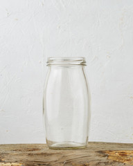Empty glass jar on rustic wooden table