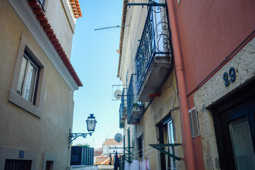 Typical portuguese streets, apartment windows and houses on traditional district scene in Lisbon, Portugal. historical structure view.