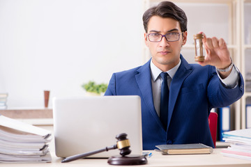 Young handsome judge working in court