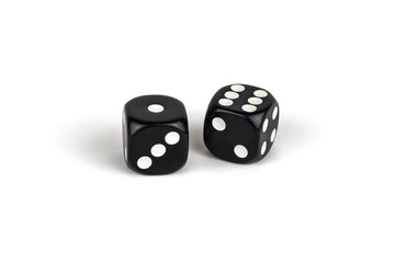 Two black dice isolated on a white background. One and six