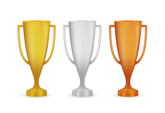 Realistic award winner cups. Golden, silver and bronze trophy set. Vector illustration.