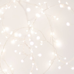 Abstract Silver Christmas Winter Background with festive glowing bokeh lights, copyspace