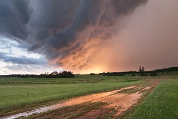 Fotobehang Mysterious funnel cloud splits the horizon into good and evil before bringing heavy rain. © Joce