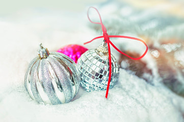 Christmas balls on the snow, selective focus. Christmas or New Year concept.