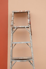 painters rust staircase and nude color wall .