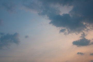 multicolor sky with vanilla and blue color , black big cloudy .