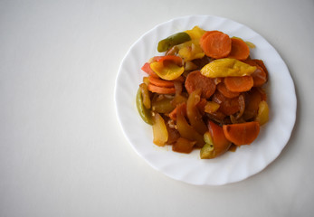 Vegetables on a white dish.