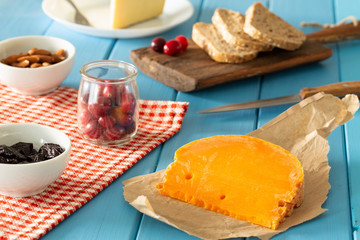 Mimolette type of cheese together with the addition of bread, fresh cranberries, almonds…