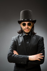 Vintage concept with man wearing black top hat