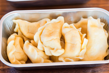Dumplings or vareniki with stuffing served as airplane food