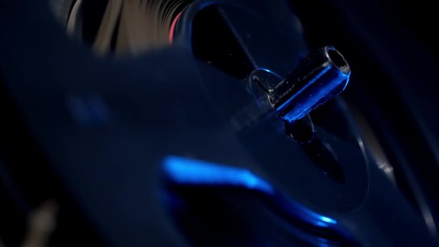 Retro reel tape recorder with blue light close-up 