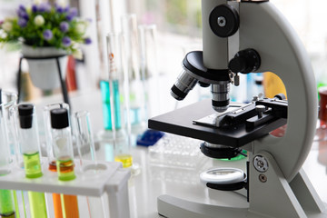 Microscopes and test tubes For scientific research in the chemistry laboratory on the table.