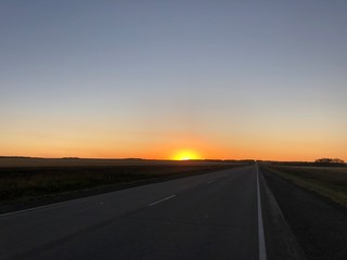 Obraz na płótnie Canvas road at sunset