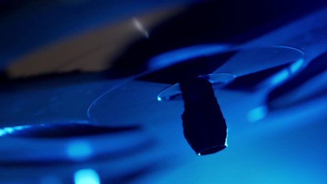 Spinner reel tape of retro recorder with blue light background light