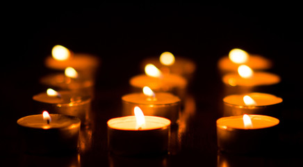 Burning candles in the dark