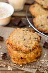 Oatmeal cookies with chocolate served with milk