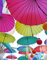 Many spanned colorful umbrellas in the sky - aufgespannte bunte Schirme am Himmel

