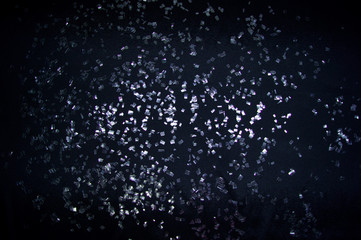 Shards of glass on the black background