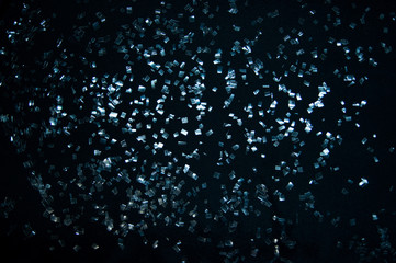 Shards of glass on the black background