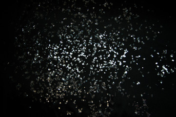 Shards of glass on the black background