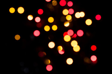 Obraz premium Red and yellow bokeh. Blurred lights background