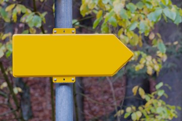 Blank yellow arrow showing the direction in nature, space for text