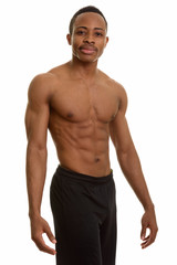 Fototapeta premium Young handsome and muscular African man shirtless