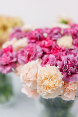Bouquet of carnation flowers pink and violet color. Spring background. Clove bunch present for Mothers Day.