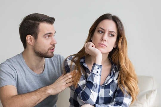 Wife offended by husband, man asks for forgiveness. Angry depressed young woman has no desire to talk, listening to lies of her boyfriend saying sorry. Troubles in family, misunderstanding, distrust