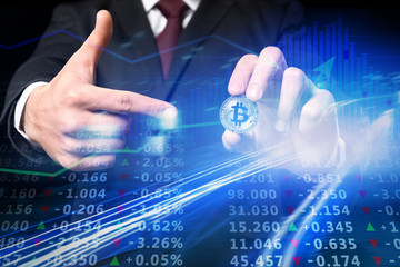 Man with silver bitcoin on black background, closeup