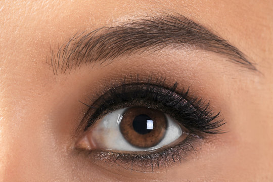 Eye of beautiful young woman with lash extensions, closeup