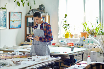 Man using tablet in workshop