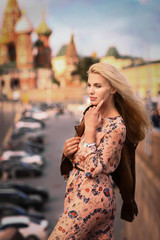 Naklejka premium blond fashion model russian girl close up photo on red square background