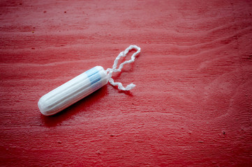 tampon on a red background