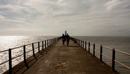 Couple Walking on Promenade 