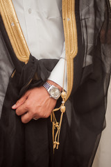 Arab groom with watches at his wedding