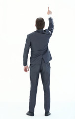 rear view. businessman pointing to copy space.
