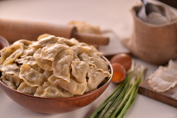many dumplings in a clay bowl, cooking food, series