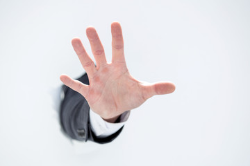 hand of a businessman showing stop gesture