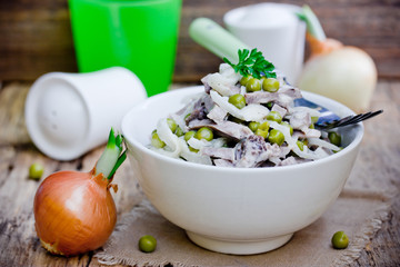 Meat, onion and peas mixed salad, russian cuisine