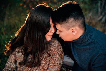 Summer Camp Fire. Tourism sexy photo. Cute couple kissing in the park on a sunny day. Adventure concept. Man and woman kissing. Couple in love. Camping fire. Love story. Romance lovers. Fashion photo.