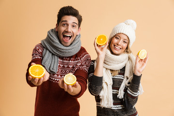 Portrait of a happy young couple dressed in sweaters