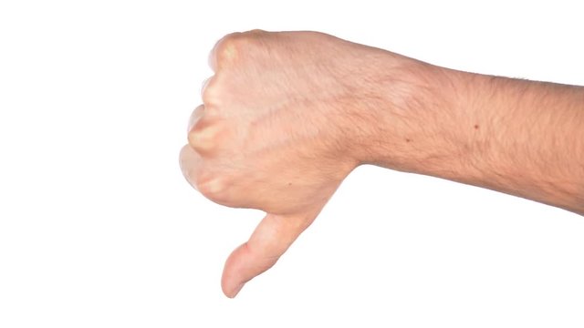 Hand of man showing disapproval by giving a thumbs down. White background
