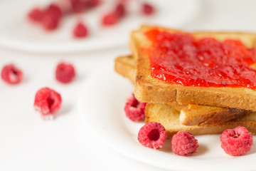Toast with jam in white plate